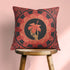 Square pillow cover featuring a golden skeleton hand holding a coral hibiscus flower, surrounded by fan-shaped coral motifs on a black background in an Art Nouveau style.