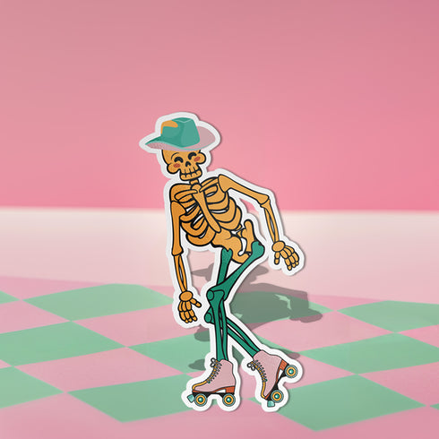 A sticker featuring a whimsical skeleton dressed in a green cowboy hat, casually posed with one leg propped up. The skeleton sports a full grin and is adorned with vibrant teal and orange roller skates, adding a playful and surreal touch to the design.
