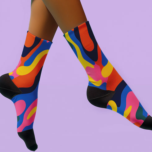 Glossy black pinback button with floral art and bold white text that reads “Hands Off My Body.” Feminist political button featuring bright pastel flowers in pink, red, orange, and yellow. Metal pin with durable safety pin back, shown in various settings: held by hand, displayed on pedestal, and against colorful street art. Available in 2" and 3" sizes, perfect for backpacks, jackets, tote bags, or as a gift for feminist allies and book lovers.