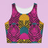 Vibrant Y2K maximalist crop top featuring bold pink tiger faces, tropical leaves, and geometric patterns in bright magenta, yellow, teal, and black colors. Perfect festival rave wear, alternative fashion, and retro summer styling for women who love aesthetic streetwear and unique animal print outfits
