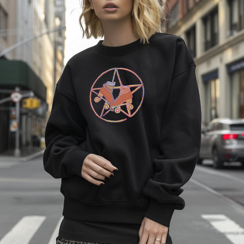 Black sweatshirt featuring a colorful pentagram design with a roller skate in the center, surrounded by dried flowers and set on a textured background.