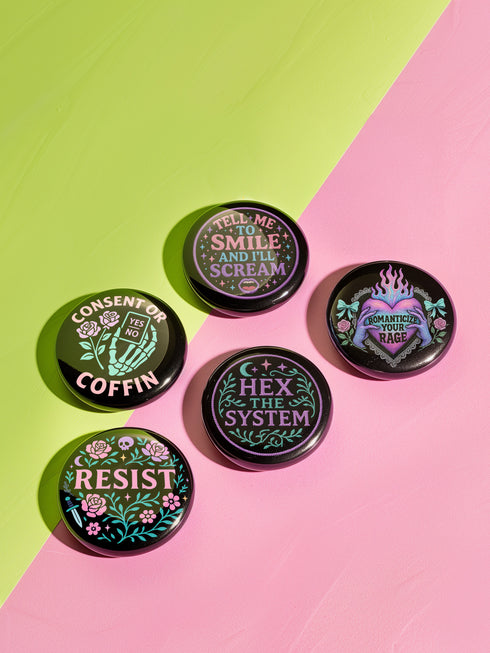 Set of five 2.25-inch round button pins featuring feminist and witchy designs with pastel artwork on a black background. Includes slogans like “Hex the System,” “Tell Me to Smile and I’ll Scream,” “Romanticize Your Rage,” “Consent or Coffin,” and “Resist.” Each button has a safety pin backing, a durable tinplate body, and a glossy, scratch and UV-resistant finish with purple, pink, teal, and mint accents.