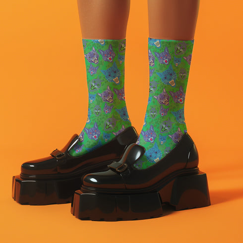 Fun and playful socks adorned with vibrant tiger head motifs on a green background, with black heels and toes, ideal for animal lovers and those who enjoy unique designs