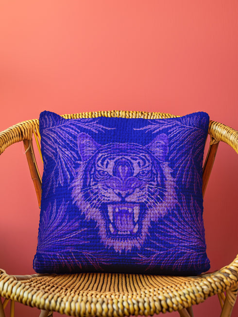 Square woven pillow featuring fierce magenta tiger with bared fangs against electric purple background surrounded by neon jungle leaves. Textured tapestry creates vibrant maximalist tiger decor perfect for gothic, y2k or eclectic room styling.