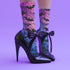 Black crew socks featuring an ombre pink-to-blue gradient with silhouetted bats and spiderweb details.