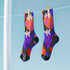 Black crew socks featuring an oversized, abstract strawberry pattern in bright pink, blue, and orange.