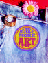 A round embroidered patch with the words "MAKE MORE ART" in a retro 70s psychedelic font. The word "ART" is magenta pink, "MAKE MORE" is purple, and they are set against a bright yellow circular background. The entire design is encircled by a thin pink line and a thick purple border. This 3-inch iron-on applique is a colorful, groovy accessory for DIY projects, perfect for personalizing jackets, backpacks, or denim vests. It serves as an inspirational artist gift with a vintage aesthetic.