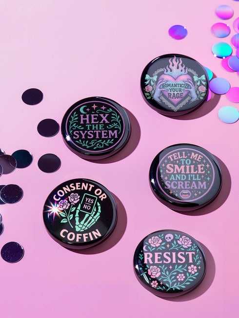 Set of five 2.25-inch round button pins featuring feminist and witchy designs with pastel artwork on a black background. Includes slogans like “Hex the System,” “Tell Me to Smile and I’ll Scream,” “Romanticize Your Rage,” “Consent or Coffin,” and “Resist.” Each button has a safety pin backing, a durable tinplate body, and a glossy, scratch and UV-resistant finish with purple, pink, teal, and mint accents.