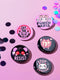 A set of five glossy round pinback buttons with pastel goth and kawaii punk designs, featuring slogans like "Eat The Rich" and "Stop Fascism" in bold pink and black. Each pin has a cute character with a rebellious message.