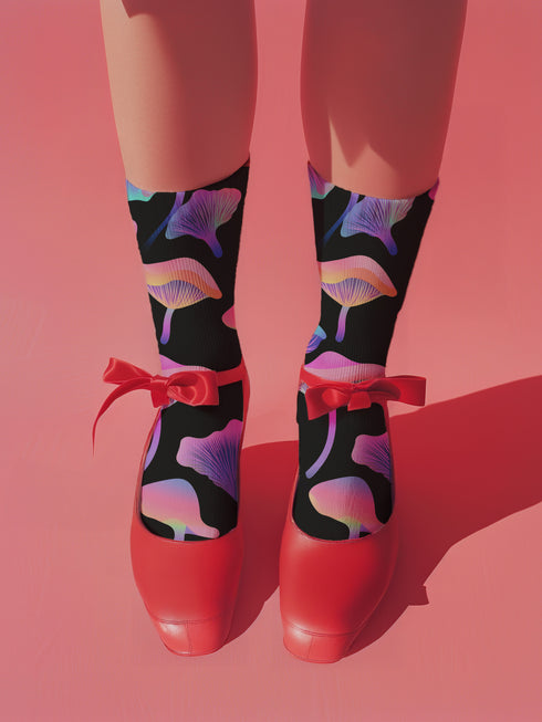 Black crew socks with an allover design of iridescent neon mushrooms in shades of pink, blue, and purple.