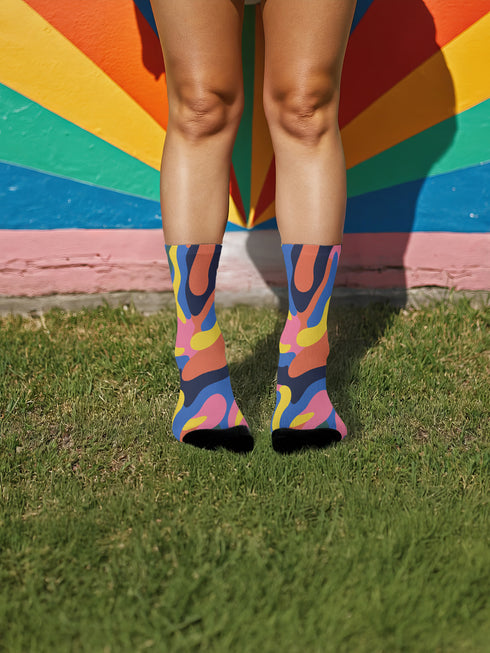 Glossy black pinback button with floral art and bold white text that reads “Hands Off My Body.” Feminist political button featuring bright pastel flowers in pink, red, orange, and yellow. Metal pin with durable safety pin back, shown in various settings: held by hand, displayed on pedestal, and against colorful street art. Available in 2" and 3" sizes, perfect for backpacks, jackets, tote bags, or as a gift for feminist allies and book lovers.