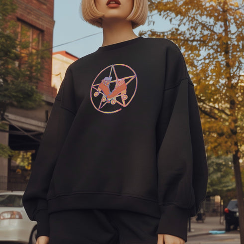 Black sweatshirt featuring a colorful pentagram design with a roller skate in the center, surrounded by dried flowers and set on a textured background.