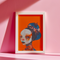 Avant-garde digital portrait of an African woman with striking features against a vivid orange background. An elaborate headdress of dark, floral elements creates a stunning contrast, embodying surrealist themes and African cultural motifs.