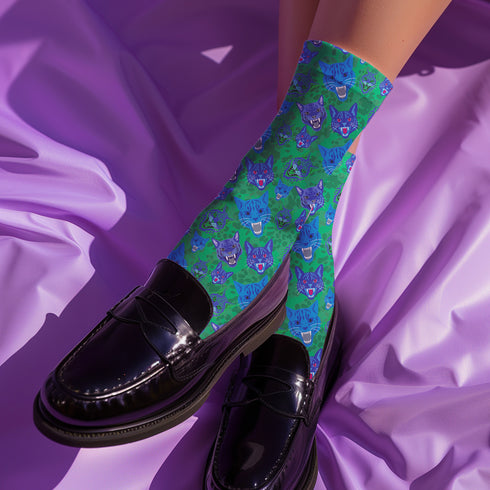 un and playful socks adorned with vibrant tiger head motifs on a green background, with black heels and toes, ideal for animal lovers and those who enjoy unique designs