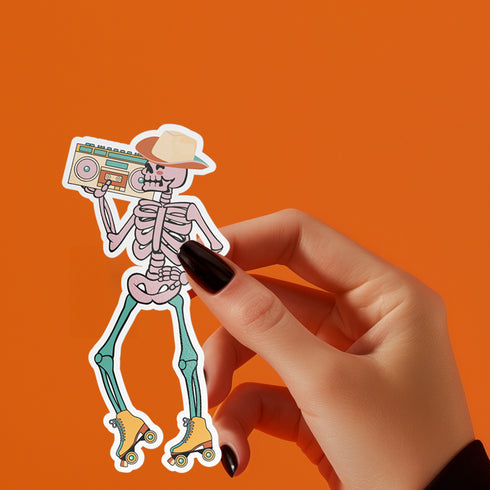 Sticker featuring a skeleton wearing a cowboy hat and holding a boombox on its shoulder, clad in roller skates. Perfect for adding a playful touch to any surface.