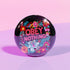 A black round pinback button featuring floral embroidery-style designs and bold red text that reads "Obey Nothing."