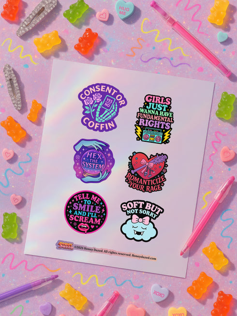 Feminist sticker sheet measuring 9.8x14 inches featuring 6 kiss-cut vinyl stickers with matte finish. Includes designs: “Consent or Coffin” (4.1x4), “Girls Just Wanna Have Fundamental Rights” (3.5x4.1), “Hex the System” (3.6x3.7), “Romanticize Your Rage” (3.7x3.3), “Tell Me to Smile and I’ll Scream” (3.6x3.6), and “Soft But Not Sorry” (~3.3"). Weather-resistant, semi-permanent adhesive, ideal for laptops, water bottles, and journals.