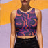 Cropped tank top with psychedelic purple and coral swirling waves pattern featuring mystical third eye designs, racerback style sleeveless womens festival top with body-hugging fit for rave outfits, alternative clothing, y2k aesthetic streetwear, trippy spiritual print crop top for concerts and music festivals, black owned shops bohemian mystical shirt