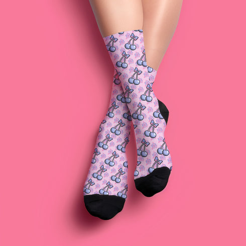 Fun and playful cherry bow-patterned pink socks with black heels and toes,  ideal for those who love quirky and cute designs