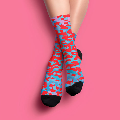 Dive into bold fashion with these vibrant socks featuring an eye-catching red, blue, and pink cheetah print pattern. Perfect for those who love to make a statement, these socks are ideal for brightening up any outfit and showcasing your unique style. Comfortable and stylish with black heels and toes, they are a must-have accessory for the fashion-forward.