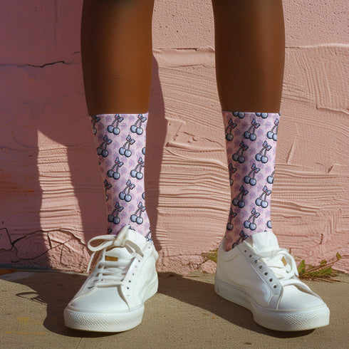 Fun and playful cherry bow-patterned pink socks with black heels and toes,  ideal for those who love quirky and cute designs