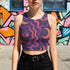 Cropped tank top with psychedelic purple and coral swirling waves pattern featuring mystical third eye designs, racerback style sleeveless womens festival top with body-hugging fit for rave outfits, alternative clothing, y2k aesthetic streetwear, trippy spiritual print crop top for concerts and music festivals, black owned shops bohemian mystical shirt