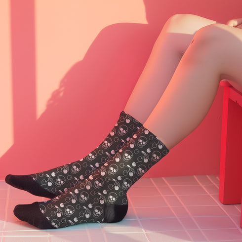 Black crew socks featuring a white skull and cherry pattern.