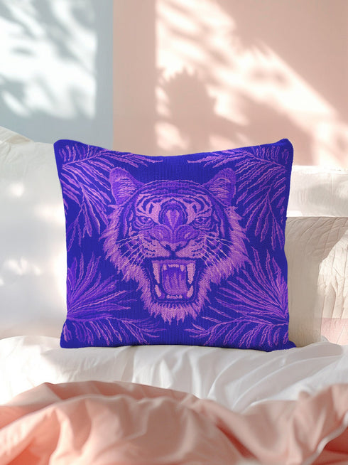 Square woven pillow featuring fierce magenta tiger with bared fangs against electric purple background surrounded by neon jungle leaves. Textured tapestry creates vibrant maximalist tiger decor perfect for gothic, y2k or eclectic room styling.