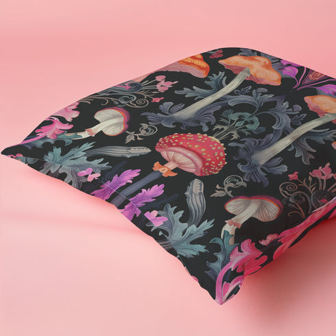 Designer throw pillow cover featuring an intricate mushroom and foliage pattern in warm oranges, soft pinks, and regal purples against a dark background.