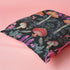 Designer throw pillow cover featuring an intricate mushroom and foliage pattern in warm oranges, soft pinks, and regal purples against a dark background.