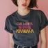 Faded vintage Black t-shirt with "Cat Ladies for Kamala" in retro-style pink and yellow lettering. Cat silhouettes accent the text.