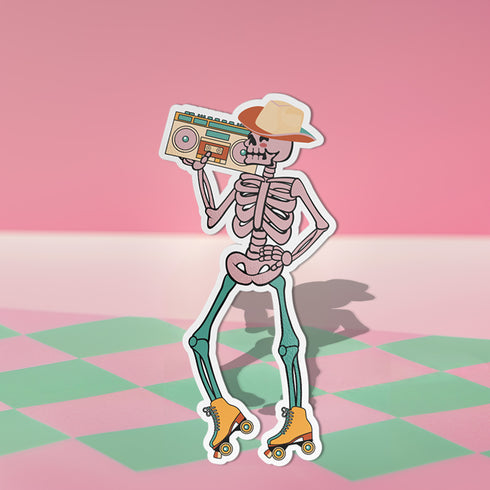 Sticker featuring a skeleton wearing a cowboy hat and holding a boombox on its shoulder, clad in roller skates. Perfect for adding a playful touch to any surface.
