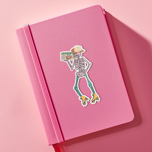 Sticker featuring a skeleton wearing a cowboy hat and holding a boombox on its shoulder, clad in roller skates. Perfect for adding a playful touch to any surface.