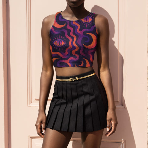 Cropped tank top with psychedelic purple and coral swirling waves pattern featuring mystical third eye designs, racerback style sleeveless womens festival top with body-hugging fit for rave outfits, alternative clothing, y2k aesthetic streetwear, trippy spiritual print crop top for concerts and music festivals, black owned shops bohemian mystical shirt