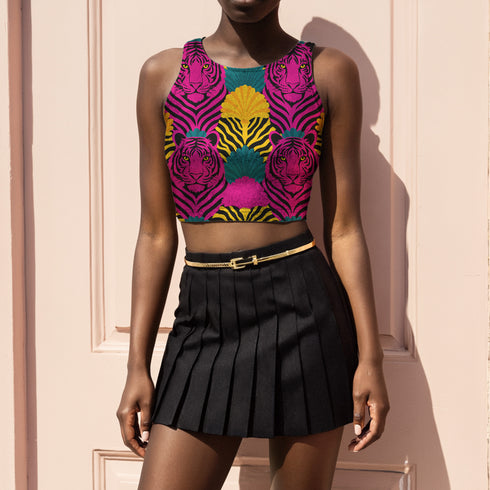 Vibrant Y2K maximalist crop top featuring bold pink tiger faces, tropical leaves, and geometric patterns in bright magenta, yellow, teal, and black colors. Perfect festival rave wear, alternative fashion, and retro summer styling for women who love aesthetic streetwear and unique animal print outfits