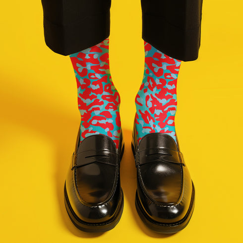 Dive into bold fashion with these vibrant socks featuring an eye-catching red, blue, and pink cheetah print pattern. Perfect for those who love to make a statement, these socks are ideal for brightening up any outfit and showcasing your unique style. Comfortable and stylish with black heels and toes, they are a must-have accessory for the fashion-forward.