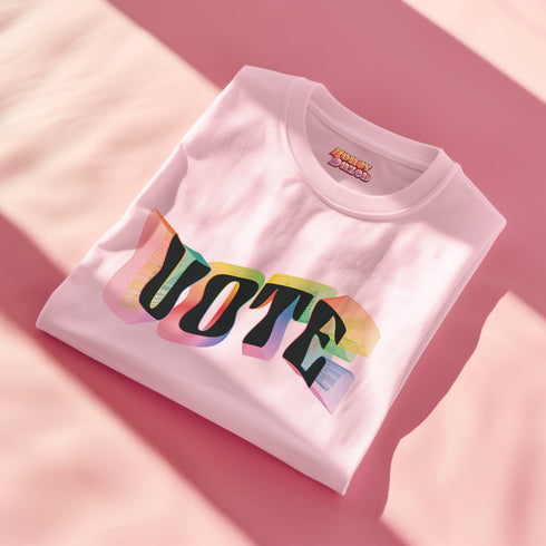 Election 2024 t-shirt with "VOTE" printed in large, colorful letters. Each letter features a different color from the rainbow spectrum, styled in a groovy 70s-inspired font.