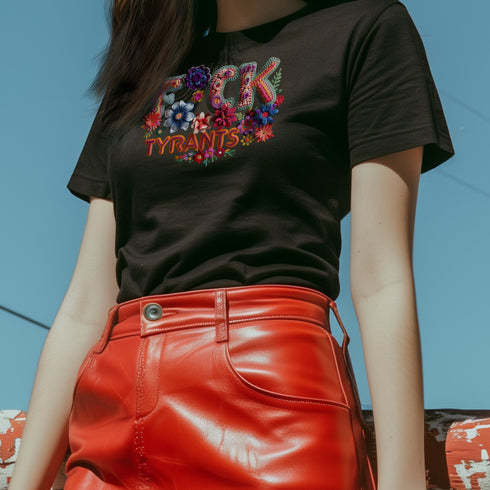 Black unisex T-shirt with bold floral embroidery-style text reading "F*ck Tyrants" in vibrant colors.