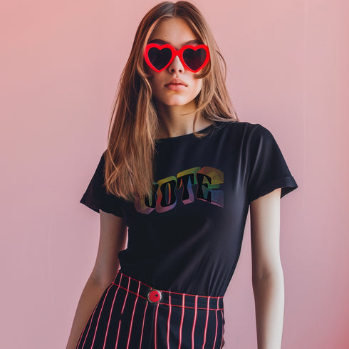 Election 2024 t-shirt with "VOTE" printed in large, colorful letters. Each letter features a different color from the rainbow spectrum, styled in a groovy 70s-inspired font.