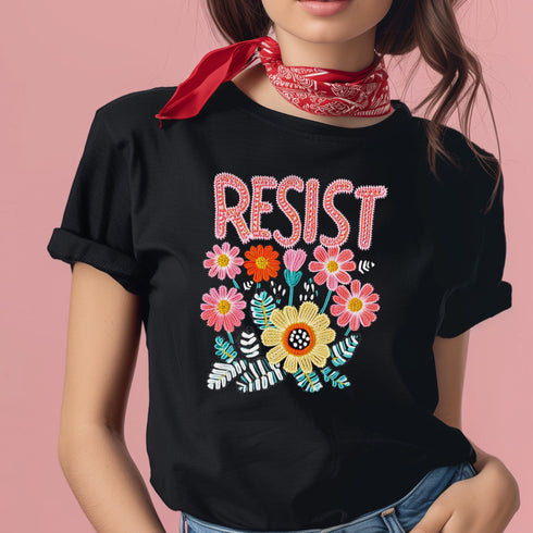Black unisex t-shirt with "Resist" in bold, embroidered-style floral print. Political activism shirt with a vintage, handcrafted feel.