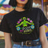 Black unisex t-shirt featuring "MY BODY MY RIGHTS" text with vibrant embroidery-style design of green skeleton figure and colorful flowers. Feminist pro-choice shirt with neon pink, blue, and yellow details available in sizes S-3XL in cotton-poly blend.