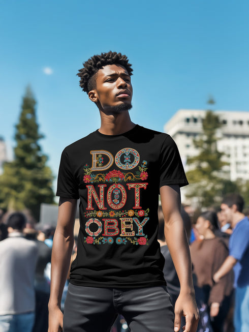 Black T-shirt with bold, embroidered-style text reading "Do Not Obey" surrounded by floral patterns.