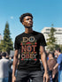 Black T-shirt with bold, embroidered-style text reading "Do Not Obey" surrounded by floral patterns.