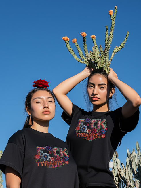 Black unisex T-shirt with bold floral embroidery-style text reading "F*ck Tyrants" in vibrant colors.
