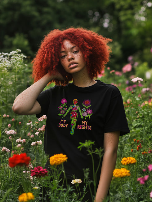 Black unisex t-shirt with "MY BODY MY RIGHTS" design featuring neon green female figure filled with vibrant pink and red flowers. Feminist pro-choice shirt with colorful text, available in cotton-poly blend, sizes S-3XL.
