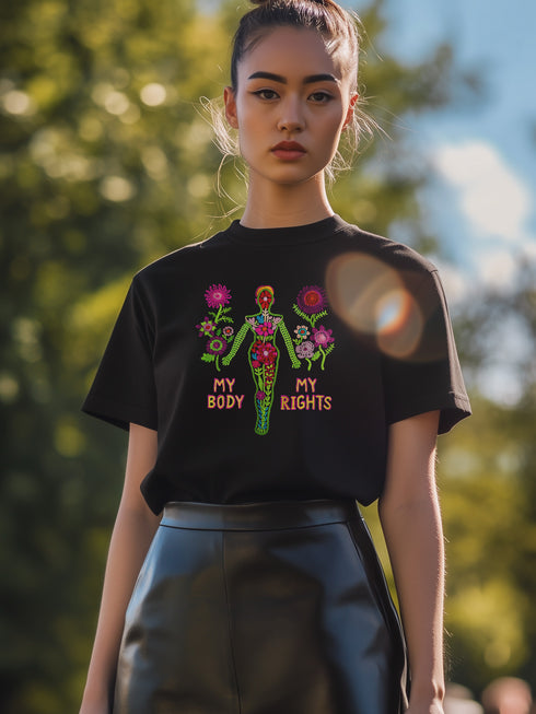 Black unisex t-shirt with "MY BODY MY RIGHTS" design featuring neon green female figure filled with vibrant pink and red flowers. Feminist pro-choice shirt with colorful text, available in cotton-poly blend, sizes S-3XL.