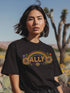 Black unisex t-shirt with "ALLY" in gold lettering under a rainbow arch, flanked by two large sunflower designs. LGBTQ+ pride ally shirt with folk art-inspired elements, available in cotton-poly blend, sizes S-3XL.