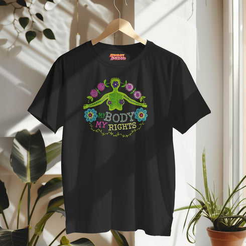 Black unisex t-shirt featuring "MY BODY MY RIGHTS" text with vibrant embroidery-style design of green skeleton figure and colorful flowers. Feminist pro-choice shirt with neon pink, blue, and yellow details available in sizes S-3XL in cotton-poly blend.