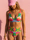 Colorful high waisted bikini set with bold floral and checkerboard print featuring pink, red, yellow, green, blue, and white tones. Scoop neck bikini top with wide straps and matching high rise bottoms with structured waistband. Smooth stretch swim fabric with symmetrical floral motifs and graphic checker pattern. Bright, retro-inspired design with vibrant color blocking and modern sporty silhouette.