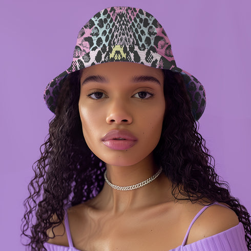 Reversible bucket hat with colorful snakeskin print in pastel shades of pink, blue, and yellow